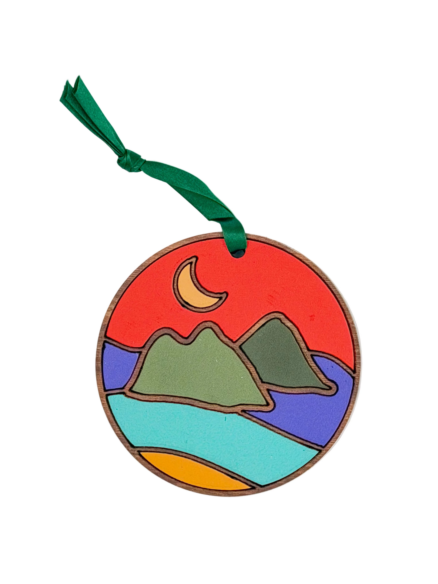 Round ornament with islands, moon, and ocean design on a white background